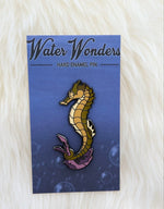 Seahorse pin on artistic backer card