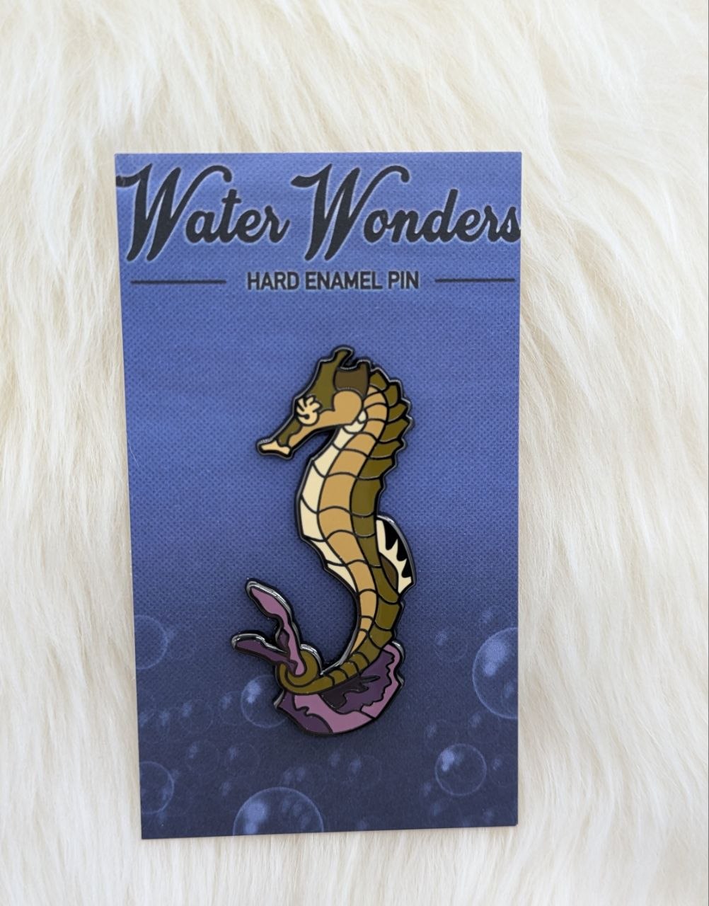 Seahorse pin on artistic backer card