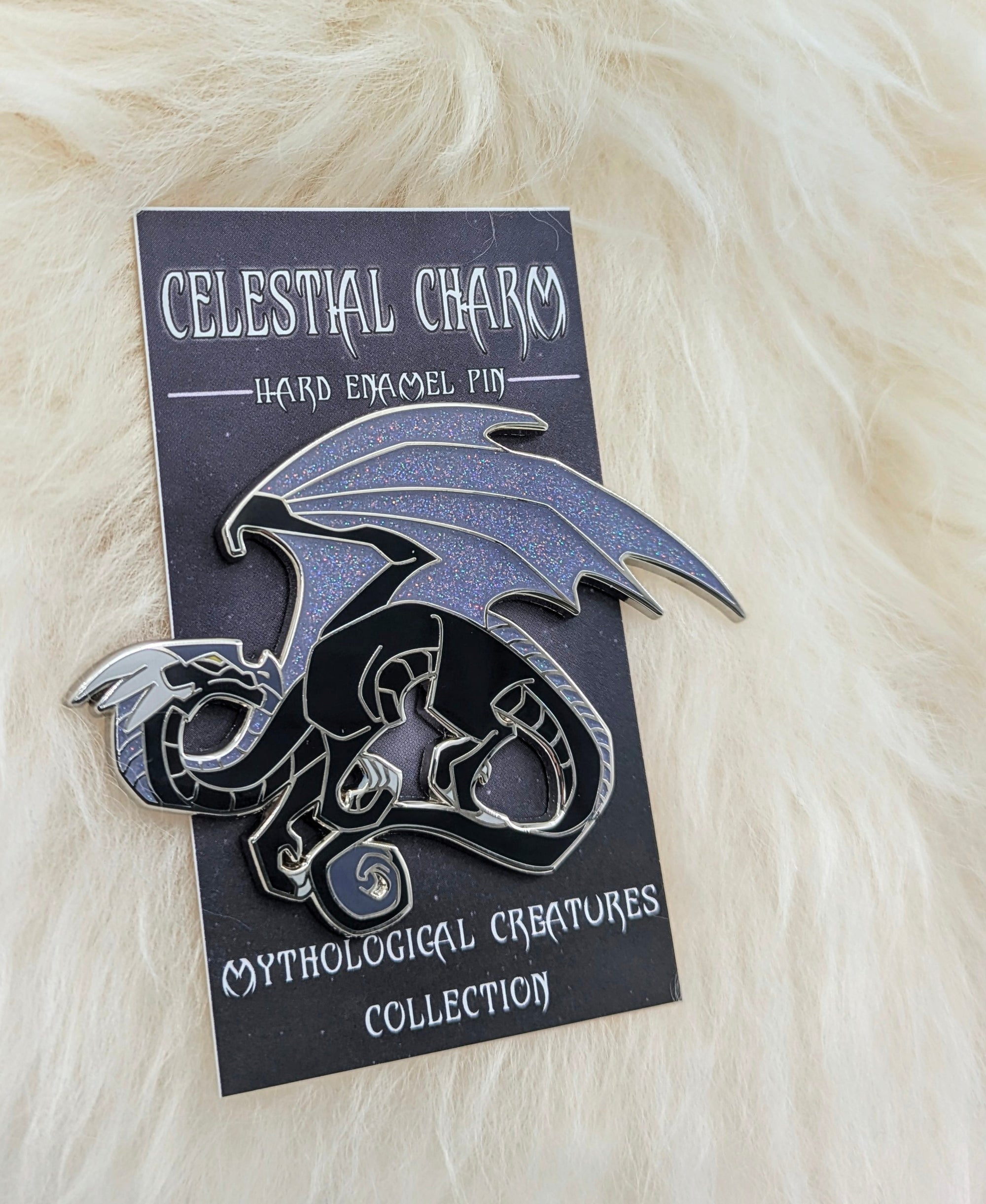 Black dragon pin on a decorative backer card