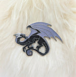 Black dragon pin on white fur