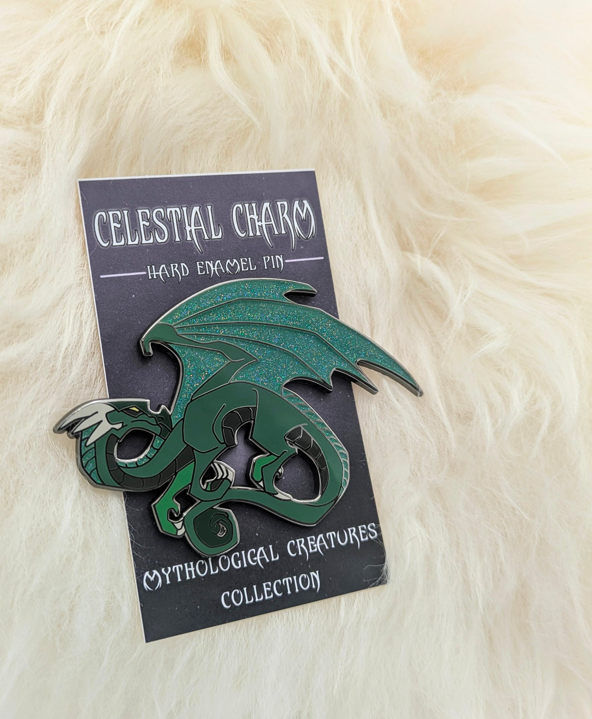 Green dragon pin on decorative backer card