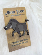 Warthog pin on a decorative backer card
