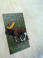 moose pin  on a decorative backer card on lambskin