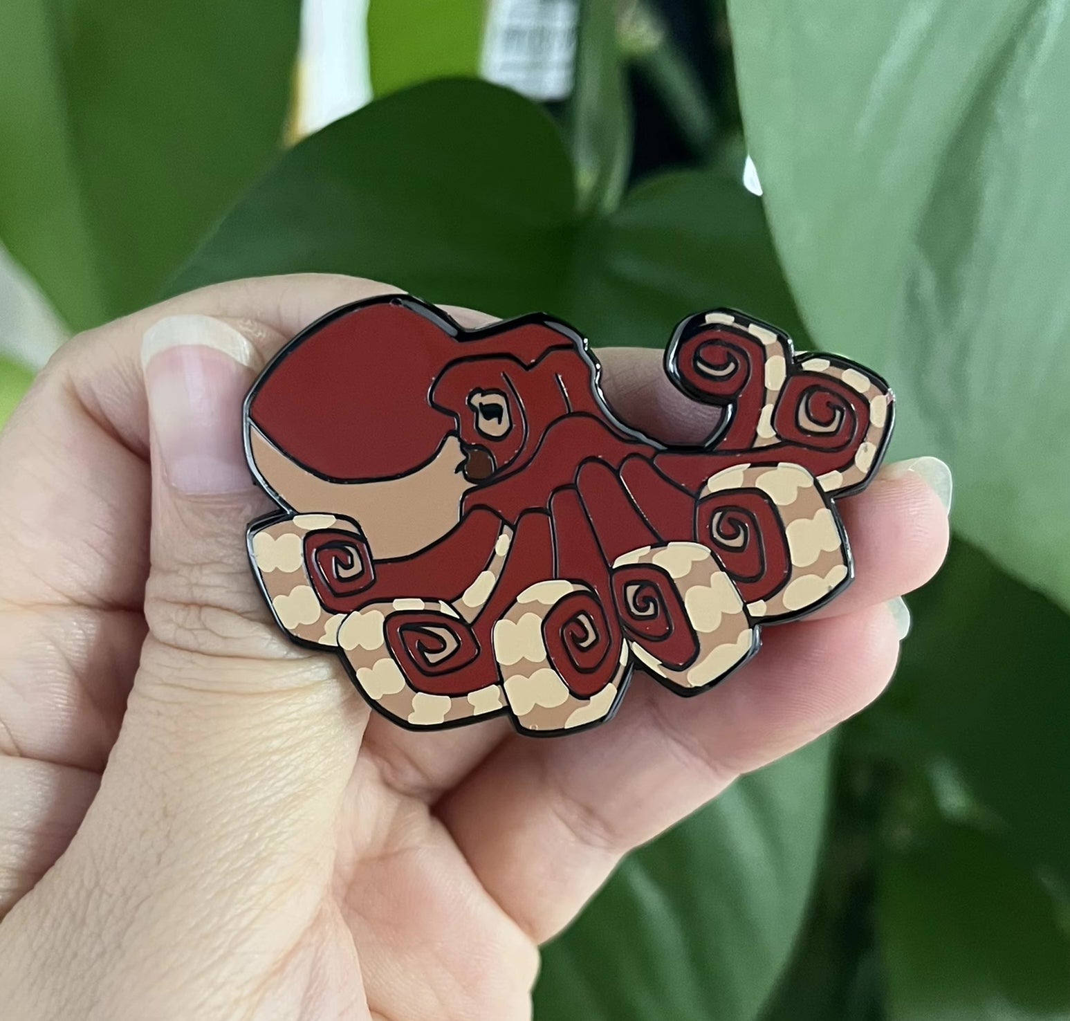 Octopus pin in hand